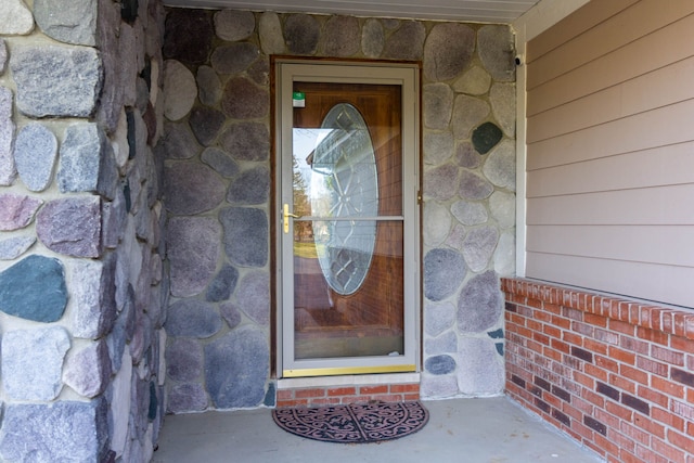 1405 S Sashabaw Rd, Ortonville, MI 48462 - view of exterior entry with stone siding