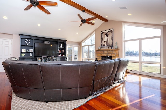 1405 S Sashabaw Rd, Ortonville, MI 48462 - living room with hardwood / wood-style floors, vaulted ceiling with beams, a fireplace, and a ceiling fan