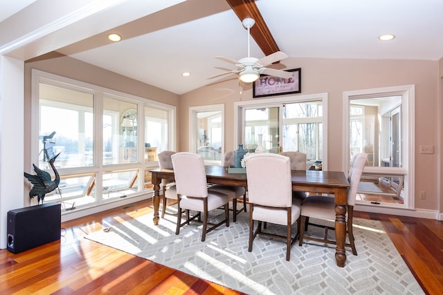 1405 S Sashabaw Rd, Ortonville, MI 48462 - dining space featuring lofted ceiling with beams, wood finished floors, a ceiling fan, and plenty of natural light