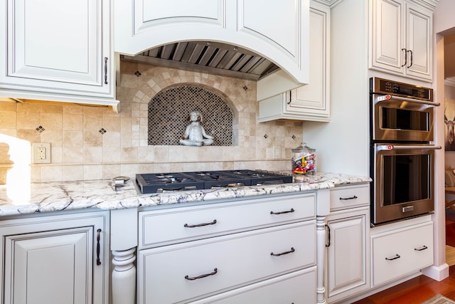 1405 S Sashabaw Rd, Ortonville, MI 48462 - kitchen featuring white cabinetry, premium range hood, backsplash, and stainless steel appliances
