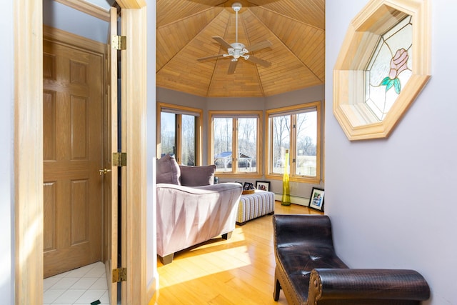 1405 S Sashabaw Rd, Ortonville, MI 48462 - bedroom with baseboard heating, wood finished floors, wood ceiling, and vaulted ceiling