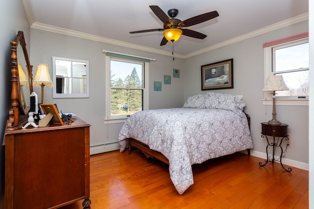 1405 S Sashabaw Rd, Ortonville, MI 48462 - bedroom featuring light wood finished floors, multiple windows, a baseboard heating unit, and ornamental molding