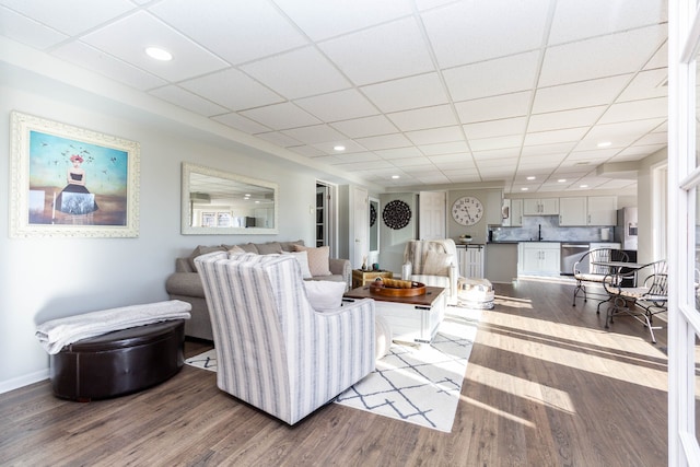 1405 S Sashabaw Rd, Ortonville, MI 48462 - living room featuring baseboards, wood finished floors, a drop ceiling, and recessed lighting