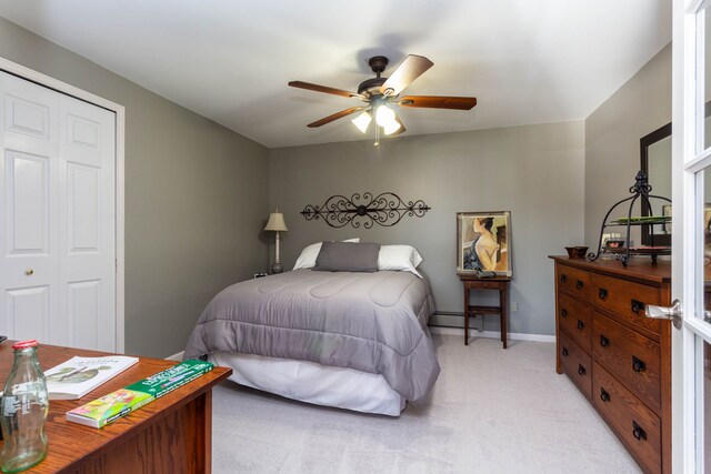 1405 S Sashabaw Rd, Ortonville, MI 48462 - bedroom featuring light colored carpet, a closet, ceiling fan, and baseboards