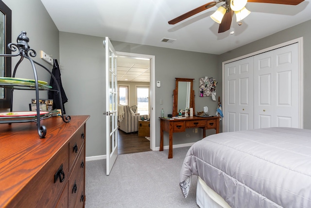 1405 S Sashabaw Rd, Ortonville, MI 48462 - bedroom with french doors, baseboards, visible vents, light carpet, and a closet