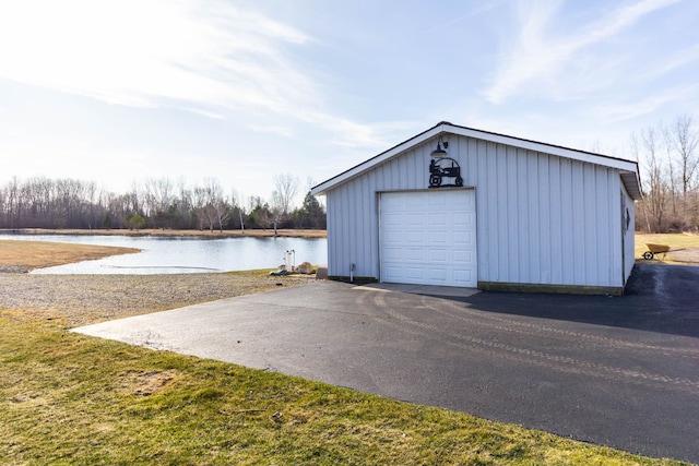 1405 S Sashabaw Rd, Ortonville, MI 48462 - detached garage featuring driveway and a water view