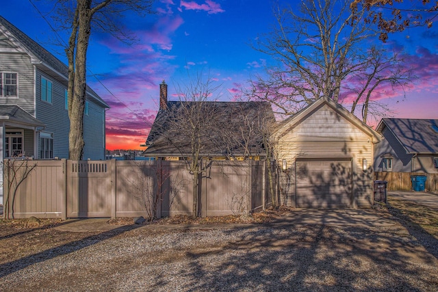 exterior space featuring driveway, a gate, and fence