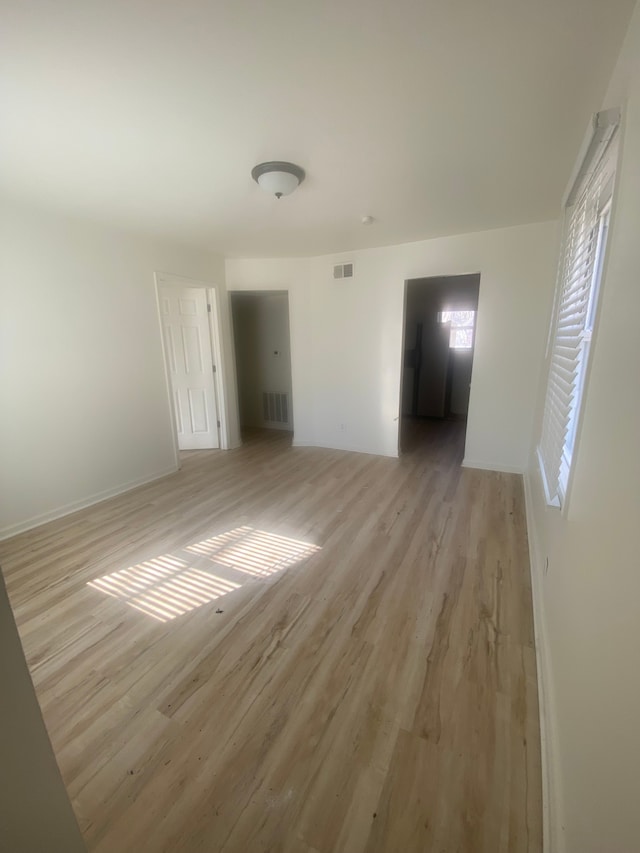 20746 Westland Dr, Southfield, MI 48075 - empty room with baseboards, visible vents, and light wood finished floors