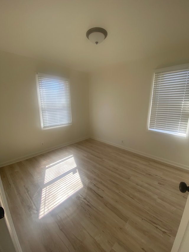 20746 Westland Dr, Southfield, MI 48075 - spare room featuring light wood-style flooring and baseboards