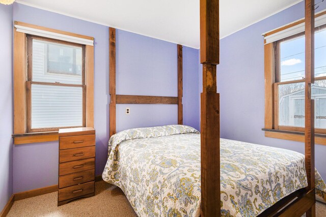 carpeted bedroom with baseboards