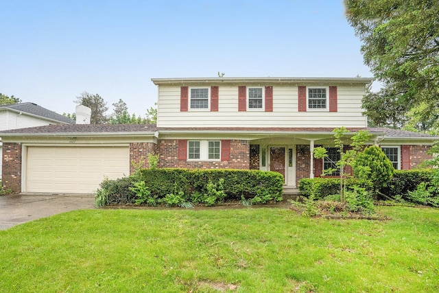 3620 Charter Pl, Ann Arbor, MI 48105 - traditional home featuring brick siding, a garage, driveway, and a front lawn