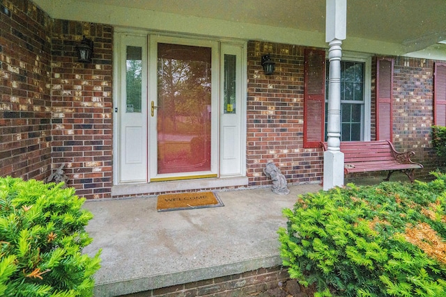 3620 Charter Pl, Ann Arbor, MI 48105 - view of exterior entry featuring covered porch and brick siding