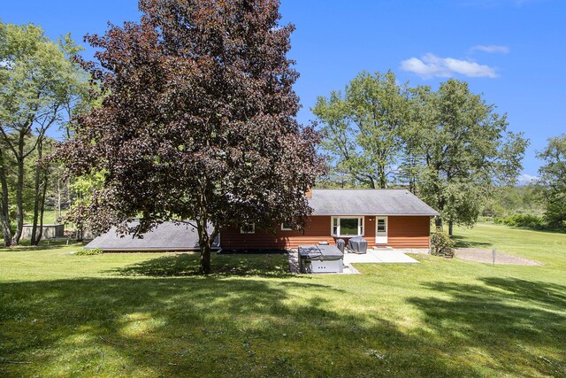 2725 W B Ave, Plainwell, MI 49080 - back of property featuring a patio area and a yard