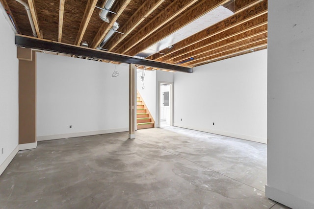 215 Nottingham Dr, Brooklyn, MI 49230 - finished below grade area featuring stairs and baseboards