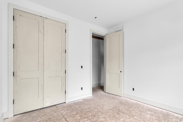 215 Nottingham Dr, Brooklyn, MI 49230 - unfurnished bedroom with a closet and baseboards