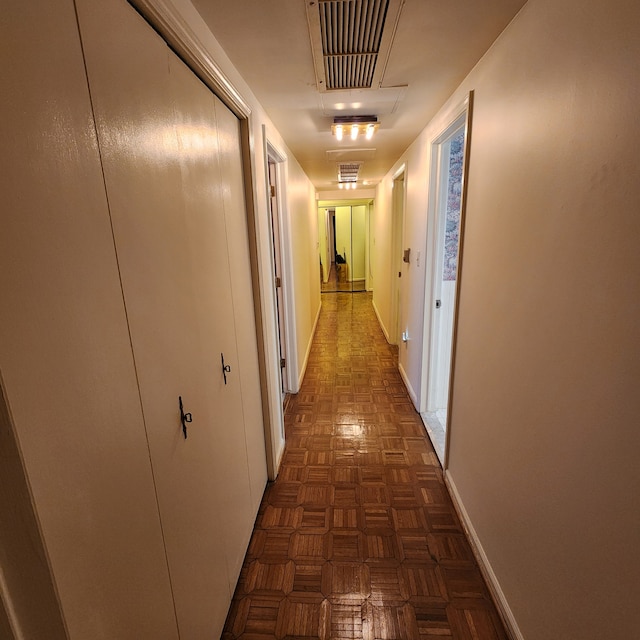 corridor with visible vents and baseboards