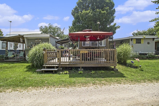 exterior space with a deck and a yard