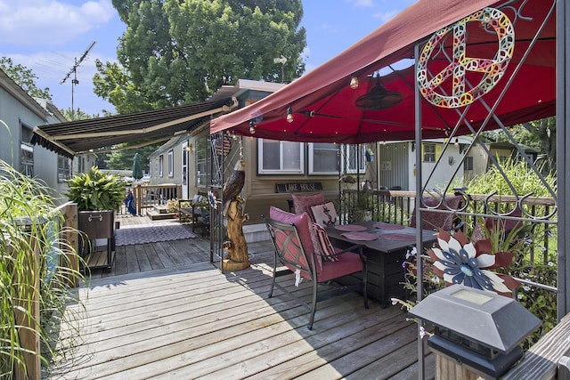 wooden deck with outdoor dining area