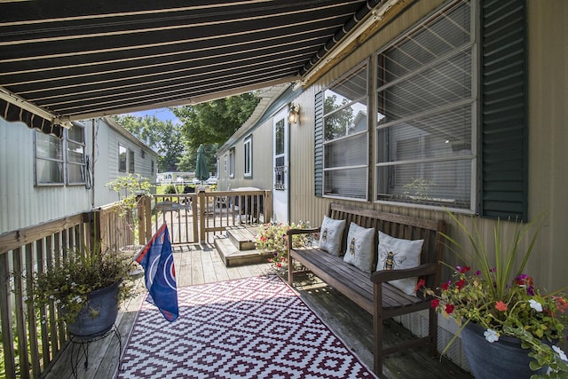 view of patio with a deck and an outdoor living space
