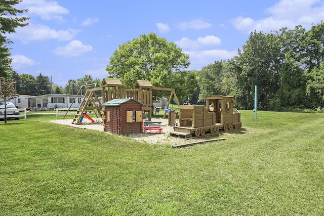 view of jungle gym featuring a lawn