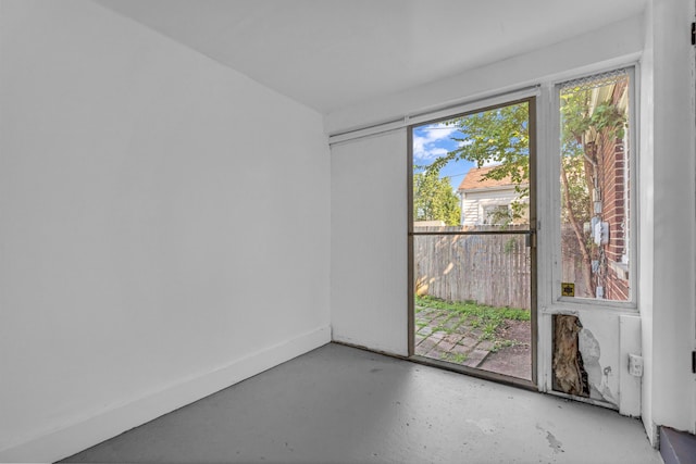 17189 Albion Ave, Detroit, MI 48234 - empty room featuring concrete flooring and baseboards