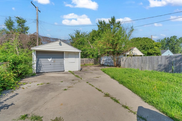 17189 Albion Ave, Detroit, MI 48234 - detached garage with fence and concrete driveway