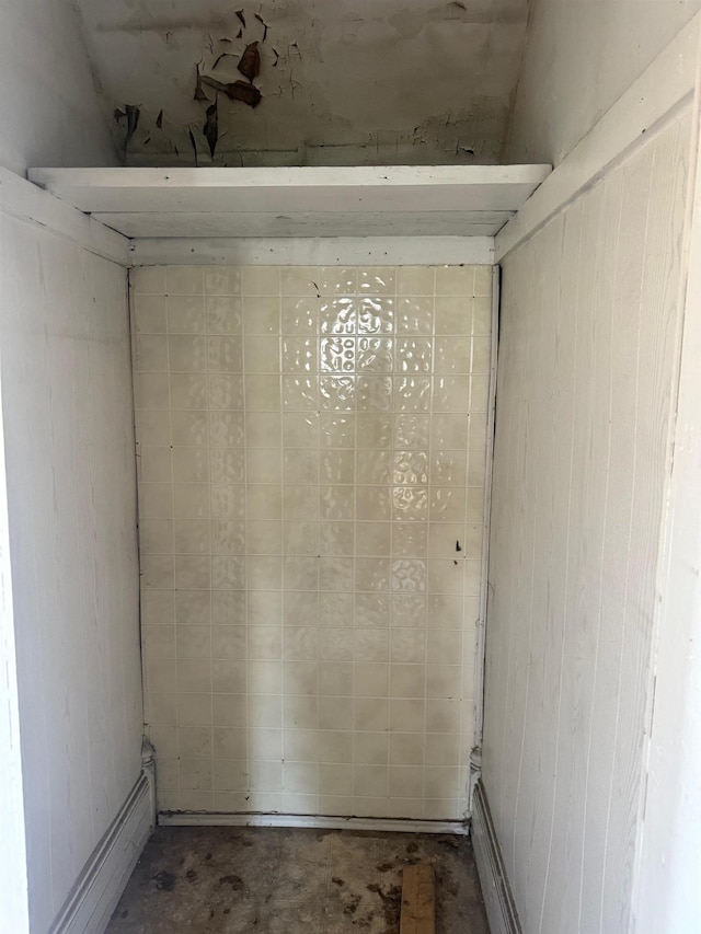 unfurnished room featuring unfinished concrete flooring