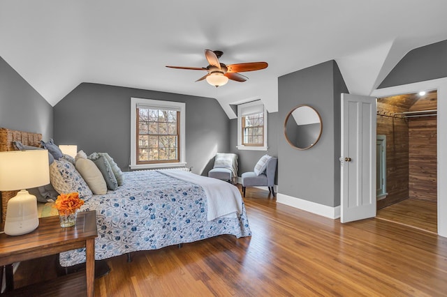 1515 W Franklin St, Jackson, MI 49203 - bedroom featuring baseboards, lofted ceiling, ceiling fan, and wood finished floors