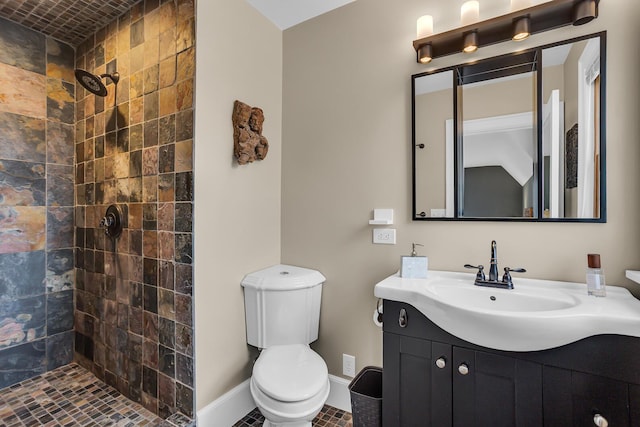 1515 W Franklin St, Jackson, MI 49203 - bathroom featuring toilet, vanity, baseboards, and tiled shower