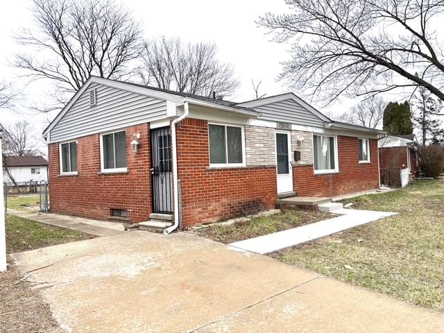 35030 Michelle Dr, Romulus, MI 48174 - view of front facade featuring brick siding, entry steps, and a front lawn