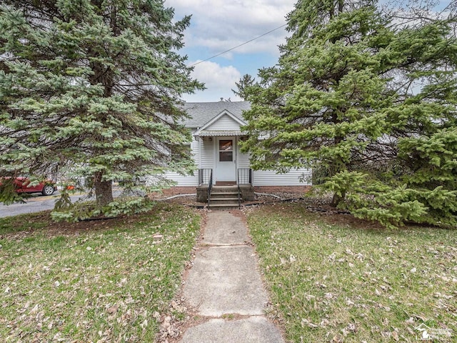 view of front of home with a front yard