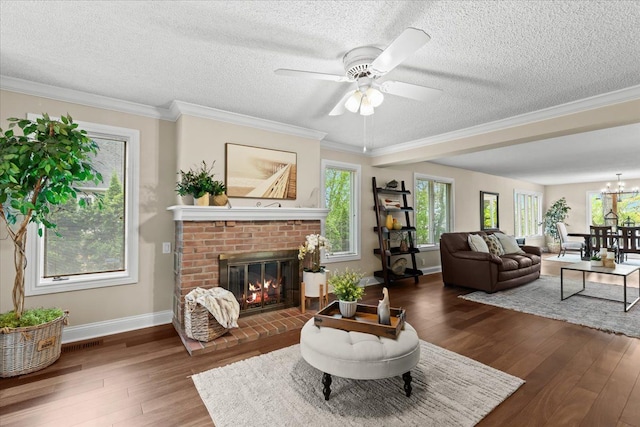 3155 Ridge Rd, White Lake, MI 48383 - living area with wood finished floors, a fireplace, baseboards, ceiling fan, and a textured ceiling