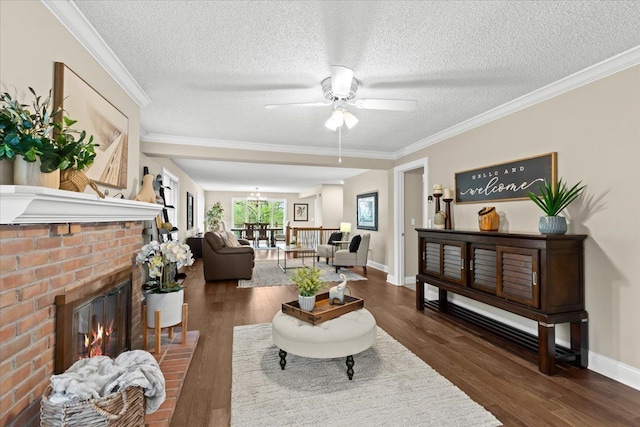3155 Ridge Rd, White Lake, MI 48383 - living area featuring ceiling fan, a textured ceiling, wood finished floors, a brick fireplace, and baseboards