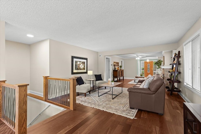 3155 Ridge Rd, White Lake, MI 48383 - living area with wood finished floors, a textured ceiling, baseboards, recessed lighting, and ceiling fan