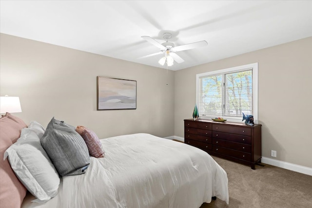 3155 Ridge Rd, White Lake, MI 48383 - bedroom with baseboards, carpet floors, and a ceiling fan