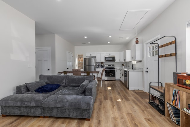 2084 W Fenwick Rd, Fenwick, MI 48834 - living area featuring recessed lighting, attic access, and light wood-style floors