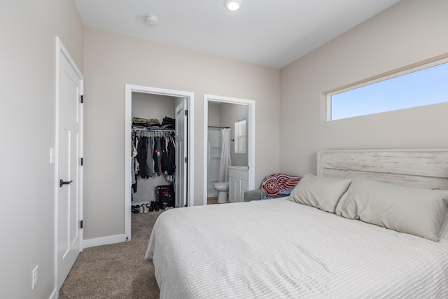 2084 W Fenwick Rd, Fenwick, MI 48834 - bedroom with a walk in closet, baseboards, a closet, carpet flooring, and ensuite bath