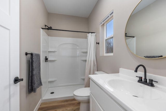 2084 W Fenwick Rd, Fenwick, MI 48834 - bathroom featuring toilet, a shower with curtain, wood finished floors, and vanity