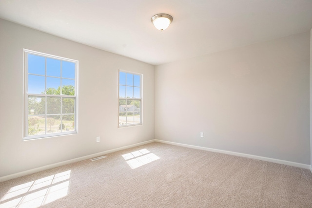 13662 Oasis Ave, Holland, MI 49424 - spare room featuring light carpet and baseboards