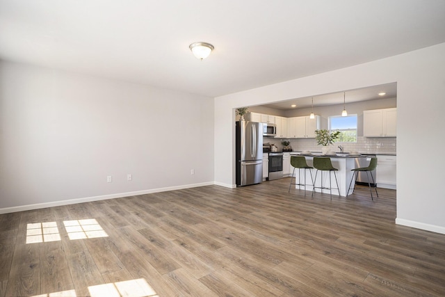 13662 Oasis Ave, Holland, MI 49424 - living area with wood finished floors and recessed lighting