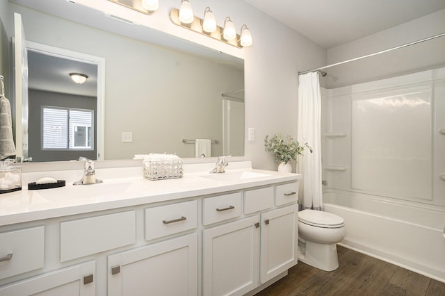 13662 Oasis Ave, Holland, MI 49424 - full bath with double vanity, shower / tub combo, and wood finished floors