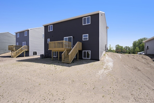 13662 Oasis Ave, Holland, MI 49424 - back of house with stairway and a wooden deck