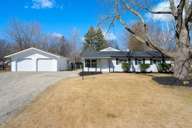 4620 Independence Dr, Clarkston, MI 48346 - ranch-style home featuring a detached garage, an outbuilding, and a front yard