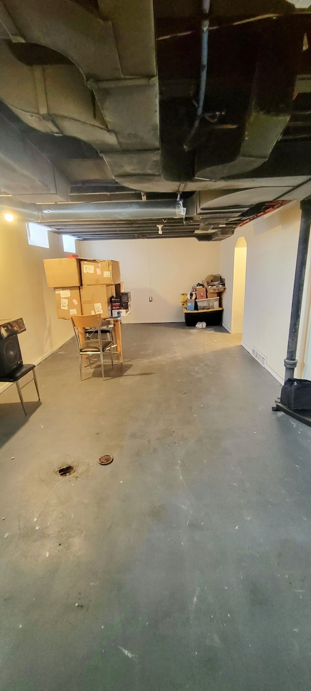 below grade area featuring arched walkways