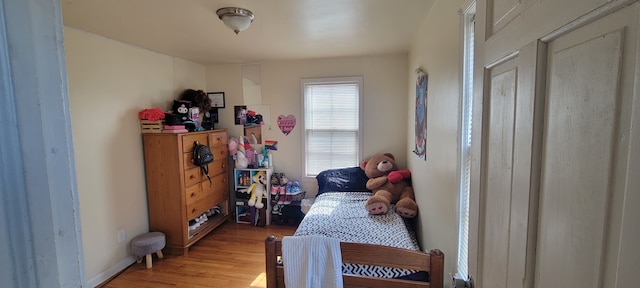 bedroom with light wood-style floors