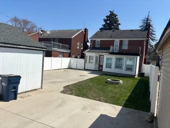 back of house featuring a patio and a fire pit