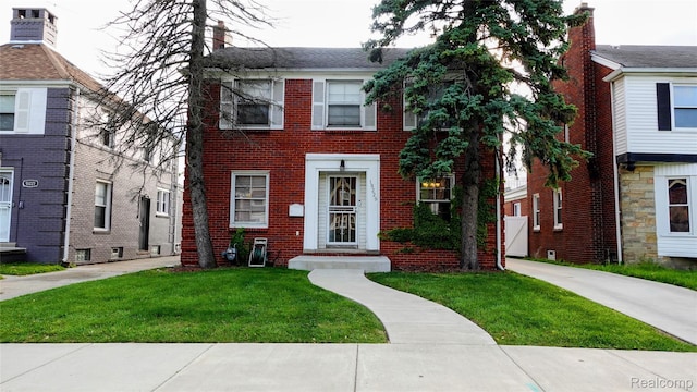 18229 Littlefield St, Detroit, MI 48235 - view of front of home featuring brick siding and a front lawn