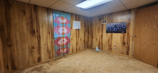889 Kirts Blvd, Troy, MI 48084 - carpeted empty room with elevator, wooden walls, and a drop ceiling