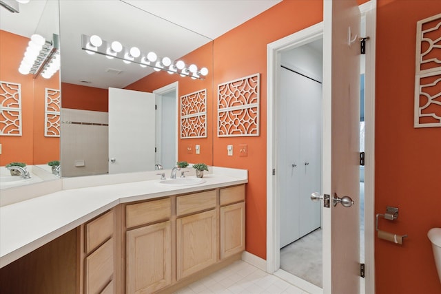 full bath featuring toilet and vanity