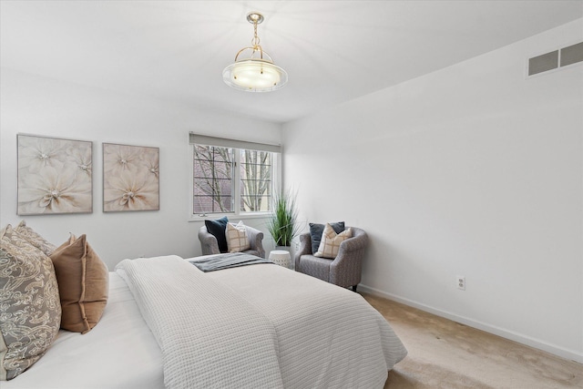 bedroom featuring baseboards, visible vents, and carpet flooring